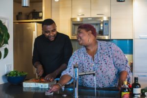 Two friends preparing an HS diet meal.