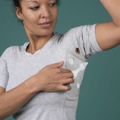 Person self-applying a HidraWear dressing for hidradenitis suppurativa